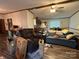 Spacious living room with wood floors and ceiling fan, connecting to the kitchen at 1925 Mt Hope Church Rd, Salisbury, NC 28146