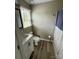 Bathroom with white vanity, toilet, wood-look flooring, neutral colored walls, and shower with curtain at 1928 Londonberry Dr, Rock Hill, SC 29730