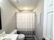 Cozy bathroom featuring neutral walls, a white toilet, and a patterned shower curtain at 1928 Londonberry Dr, Rock Hill, SC 29730