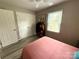 Bedroom featuring a bed, wood-look flooring, an elephant picture, and a window at 1928 Londonberry Dr, Rock Hill, SC 29730