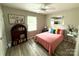 Bedroom showcasing bright bedding, neutral-toned walls, and wood-look floors with ample closet space at 1928 Londonberry Dr, Rock Hill, SC 29730