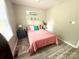 Bedroom showcasing bright bedding, neutral-toned walls, and wood-look flooring for a cozy feel at 1928 Londonberry Dr, Rock Hill, SC 29730