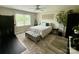 Bedroom features an exercise machine, a ceiling fan, light-colored walls, and wood-look flooring and natural lighting at 1928 Londonberry Dr, Rock Hill, SC 29730