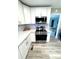 Bright kitchen features stainless steel appliances, white cabinets, and light gray backsplash at 1928 Londonberry Dr, Rock Hill, SC 29730