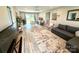 Open-concept living room with a comfortable sofa and sliding glass doors to a deck at 1928 Londonberry Dr, Rock Hill, SC 29730
