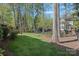 This home features a spacious backyard, mature trees, and outdoor play equipment at 19679 Wooden Tee Dr, Davidson, NC 28036