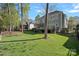 This home boasts a spacious yard and exterior living spaces including a deck and screened-in porch at 19679 Wooden Tee Dr, Davidson, NC 28036