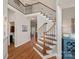 Elegant foyer with hardwood floors, wrought iron staircase, and views into other living spaces at 19679 Wooden Tee Dr, Davidson, NC 28036