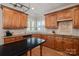 Gourmet kitchen features stainless steel appliances, ample counter space, and custom cabinets at 19679 Wooden Tee Dr, Davidson, NC 28036