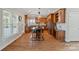 Spacious kitchen with rich wood cabinetry, stainless steel appliances, and a large island with seating, perfect for gatherings at 19679 Wooden Tee Dr, Davidson, NC 28036