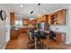 Spacious kitchen with a center island with a desk, stainless steel appliances, and custom cabinets at 19679 Wooden Tee Dr, Davidson, NC 28036
