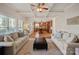 Open-concept living room view to the eat-in kitchen provides a seamless entertaining space at 19679 Wooden Tee Dr, Davidson, NC 28036