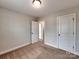 Bright bedroom showcasing neutral walls, plush carpeting, and two doors that offers accessibility at 2001 Laurel Village Cir, Belmont, NC 28012
