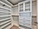 Organized walk-in closet with built-in shelving and drawers at 2001 Laurel Village Cir, Belmont, NC 28012