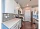 Stylish kitchen featuring sleek white cabinets, stainless steel appliances, and elegant quartz countertops at 2001 Laurel Village Cir, Belmont, NC 28012