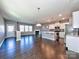 Bright open space with hardwood floors that seamlessly integrates the living room and the modern kitchen at 2001 Laurel Village Cir, Belmont, NC 28012