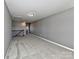 Loft with neutral gray walls, plush carpeting, ample space, and a view of the railing at 2001 Laurel Village Cir, Belmont, NC 28012