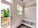 Welcoming mud room with a built-in bench and storage, flowing to the outdoor deck, perfect for entry at 2001 Laurel Village Cir, Belmont, NC 28012