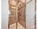 Tiled shower with glass door and built-in shelving at 2001 Laurel Village Cir, Belmont, NC 28012