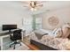 Bedroom with a ceiling fan, offering a bed, desk, and relaxing atmosphere for study and sleep at 2005 Grimley Ln, Fort Mill, SC 29707