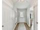 Inviting hallway with wood floors leading to an open-concept living space and plenty of light at 2005 Grimley Ln, Fort Mill, SC 29707