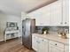 Kitchen featuring stainless steel refrigerator, white cabinets, and neutral countertops at 2005 Grimley Ln, Fort Mill, SC 29707
