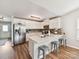 Bright kitchen with stainless steel appliances, an island with a breakfast bar, and white cabinets at 2005 Grimley Ln, Fort Mill, SC 29707
