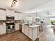 Modern kitchen with white cabinets, stainless steel appliances, and a center island at 2005 Grimley Ln, Fort Mill, SC 29707