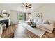 Cozy living room with fireplace, sectional sofa, and sliding glass doors leading to outdoor space at 2005 Grimley Ln, Fort Mill, SC 29707