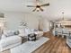 Comfortable living room flowing into dining area with modern furniture, and hardwood style floors at 2005 Grimley Ln, Fort Mill, SC 29707