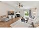 Inviting living room with fireplace, ceiling fan, and sliding glass doors for abundant natural light at 2005 Grimley Ln, Fort Mill, SC 29707