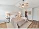 Tranquil main bedroom featuring vaulted ceiling, soft lighting, and a walk-in closet for ample storage at 2005 Grimley Ln, Fort Mill, SC 29707