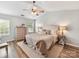 Serene main bedroom showcasing vaulted ceiling, ceiling fan, and plush bedding for restful nights at 2005 Grimley Ln, Fort Mill, SC 29707
