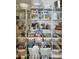 Organized pantry shelves featuring baskets and containers for optimal food storage and accessibility at 2005 Grimley Ln, Fort Mill, SC 29707