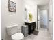 Chic bathroom with a dark vanity, a palm tree photo, and access to another room at 2048 Turnsberry Dr, Monroe, NC 28112