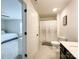 Bright bathroom featuring a shower with curtain and a dark vanity with a white countertop at 2048 Turnsberry Dr, Monroe, NC 28112