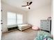 Cozy bedroom with a trundle bed, plush seating, and plenty of natural light at 2048 Turnsberry Dr, Monroe, NC 28112