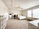 Large bedroom with ample natural light, a ceiling fan, and a dedicated workspace, perfect for comfort and productivity at 2048 Turnsberry Dr, Monroe, NC 28112