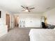 Bright bedroom with a ceiling fan, double closets, and a cozy sitting area, offering a relaxing retreat at 2048 Turnsberry Dr, Monroe, NC 28112