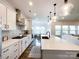 Open concept kitchen with a large island, modern appliances, and seamless flow into the living area at 2048 Turnsberry Dr, Monroe, NC 28112