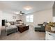 Comfortable living room with neutral tones, a ceiling fan, and plenty of seating, ideal for relaxation and entertainment at 2048 Turnsberry Dr, Monroe, NC 28112