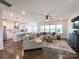 Open concept living area with hardwood floors connecting the kitchen and the living room at 2048 Turnsberry Dr, Monroe, NC 28112