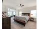Comfortable main bedroom with a ceiling fan, and access to another room with nice furniture at 2048 Turnsberry Dr, Monroe, NC 28112
