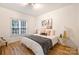 Cozy bedroom with hardwood floors, window views, and neutral decor at 20812 Decora Dr, Cornelius, NC 28031