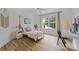 Bedroom with hardwood floors, natural light, a decorative bed frame, and minimalist decor at 20812 Decora Dr, Cornelius, NC 28031