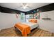 Vibrant bedroom with contrasting black and white walls, hardwood floors, and natural light at 20812 Decora Dr, Cornelius, NC 28031