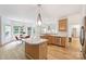 Well-lit kitchen with an island, breakfast nook, and hardwood floors at 20812 Decora Dr, Cornelius, NC 28031