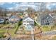 Stunning aerial view of waterfront home featuring a backyard pool, patio, and private dock at 21610 Rio Oro Dr, Cornelius, NC 28031