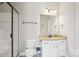 Modern bathroom with a glass-enclosed shower and a vanity with granite countertop at 21610 Rio Oro Dr, Cornelius, NC 28031