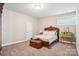 Comfortable bedroom with a decorative bed, plush carpeting, and a simple design at 21610 Rio Oro Dr, Cornelius, NC 28031